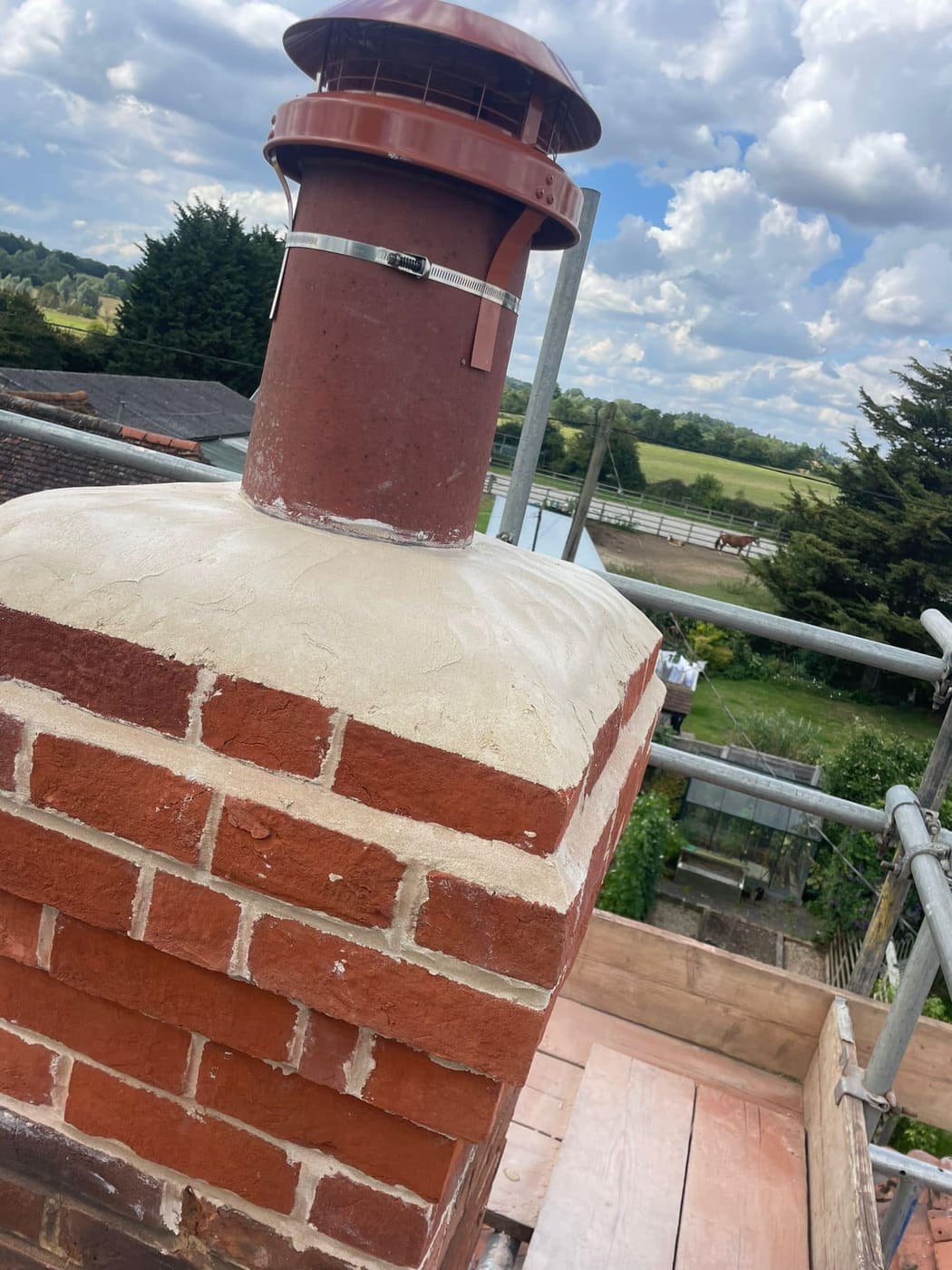 Restored chimney with a clay pot and fresh flaunching