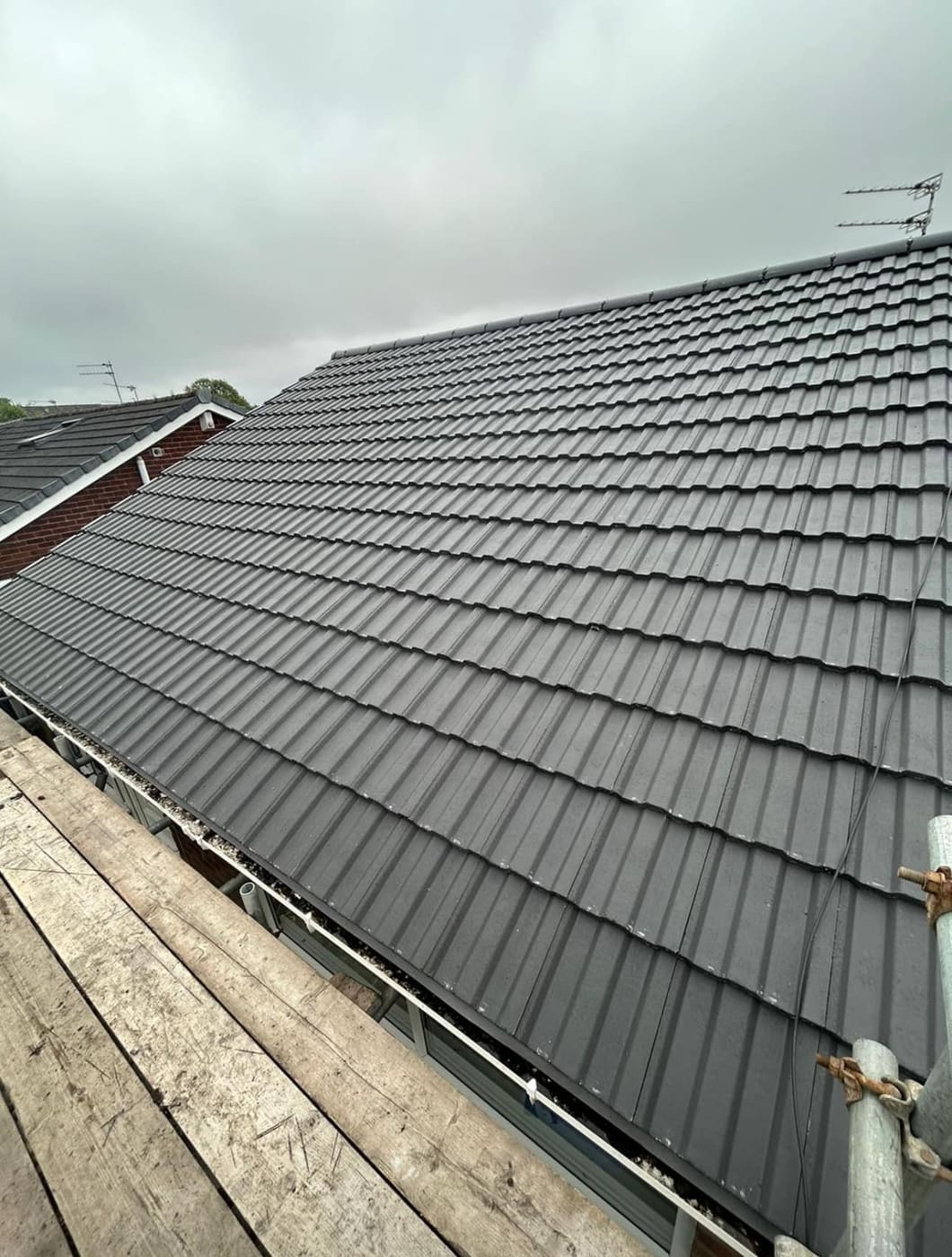 Charcoal tiled roof finished from the scaffold